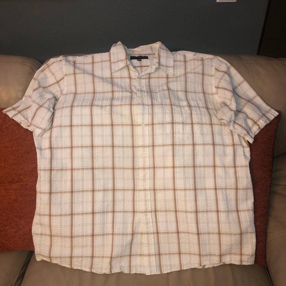 Selling a causal cream colored button down.
